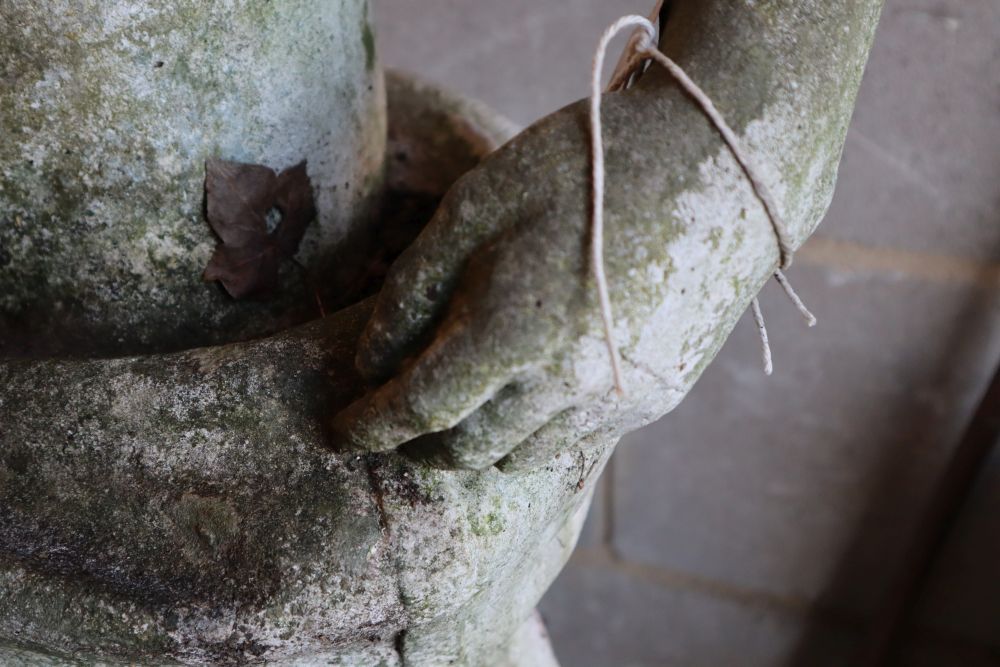 A reconstituted stone garden statue of an archer and hound, height 190cm